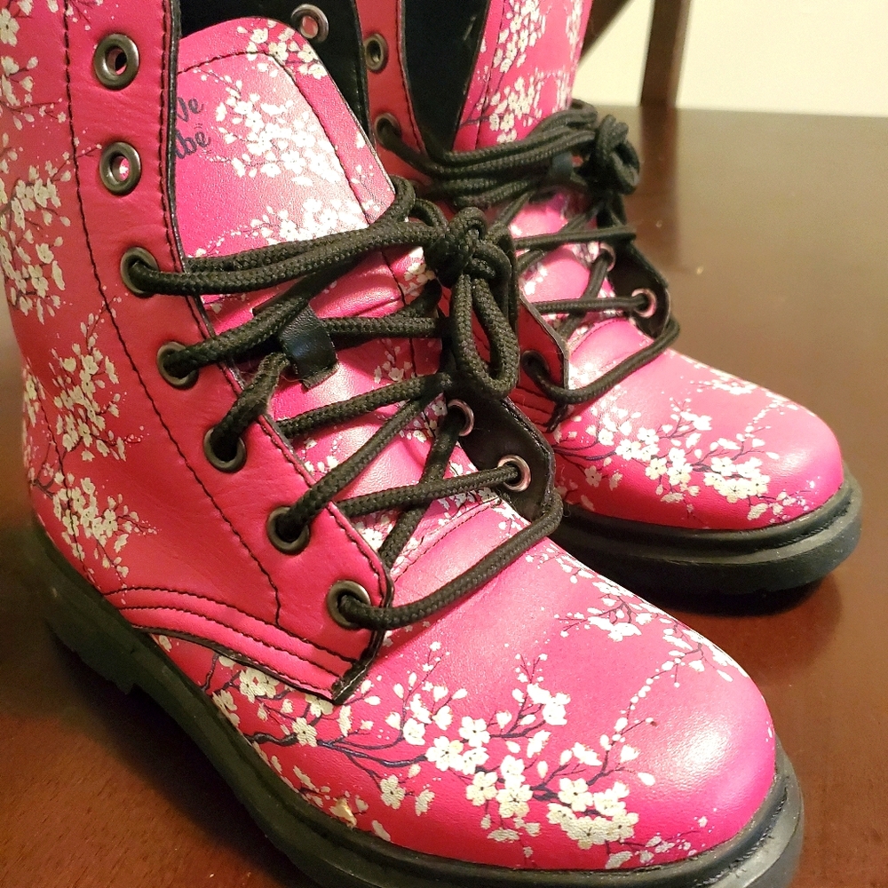 Pink lace up boots with white flowers